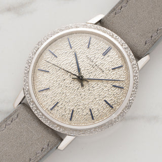 Angled view highlighting the matching hammered bezel and texture of a white gold Patek Philippe Calatrava Ref 3569