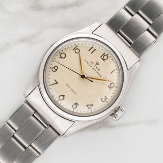 Angled close-up view of a rare vintage Rolex Air King reference 4499 luxury watch case and dial