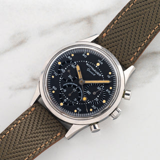1960s Wittnauer 242T Professional Chronograph displayed on a green herringbone leather strap