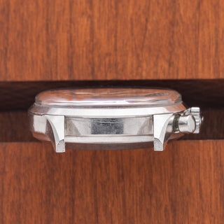 Horizontal case profile displaying the sharp, unpolished bevels and lug thickness on a 1960s Wittnauer 242T