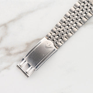 Close-up view of the rare stainless steel Kestermade Bambi folding clasp signed with the Wittnauer emblem