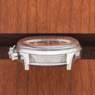 Horizontal case profile showing the unpolished steel case, crown, and Valjoux 72 chronograph pushers on a Wittnauer 242T